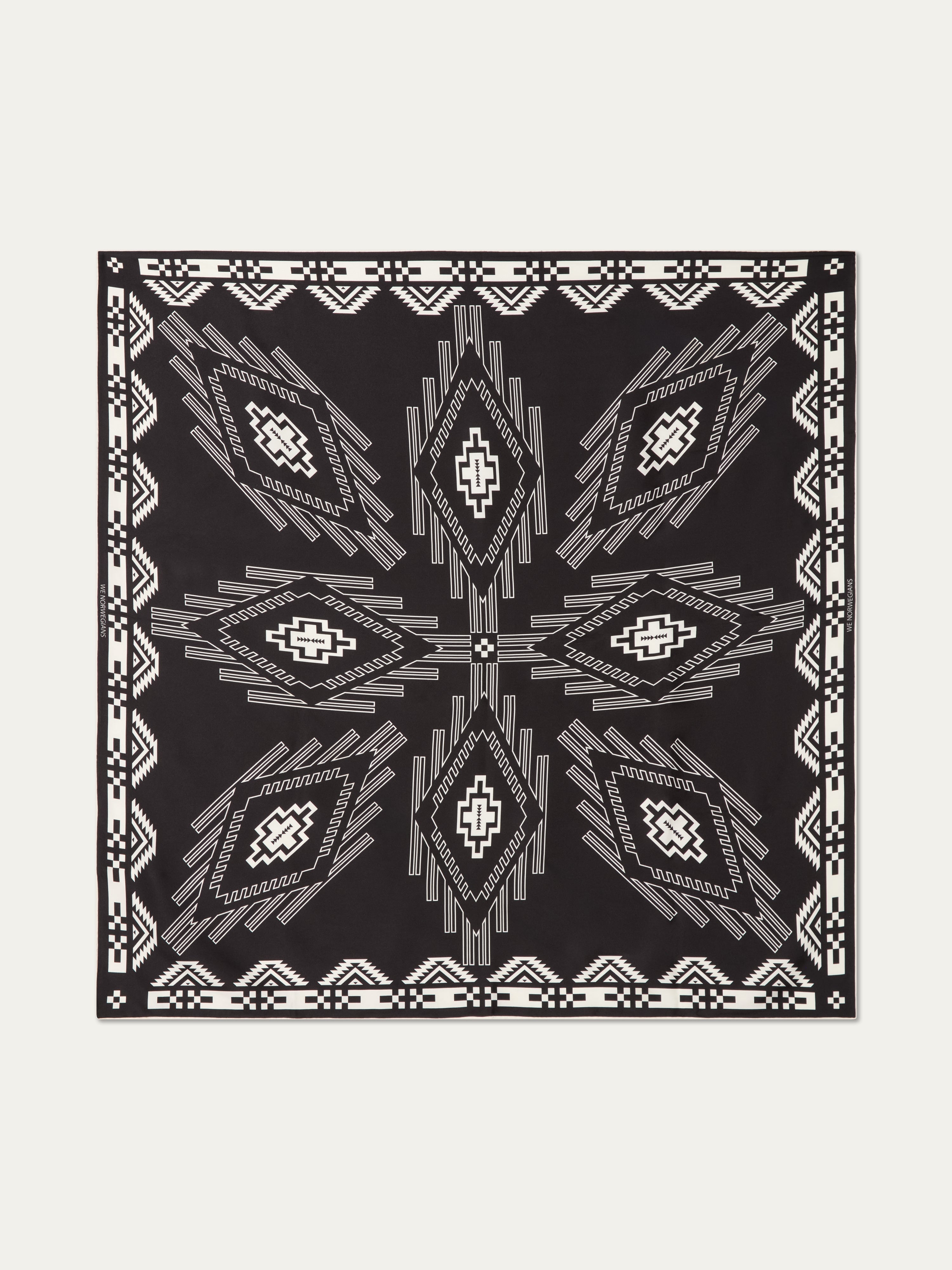 We Norwegians | FW25 | Pioneer Silk Scarf_Black | Scarf with printed motifs | Shot against an off-white background